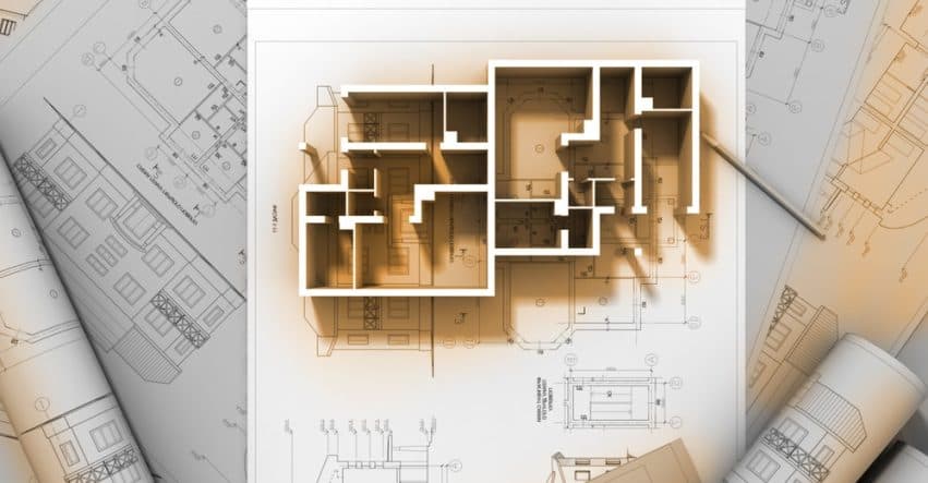 Architectural blueprints and tools for quantity surveying.
